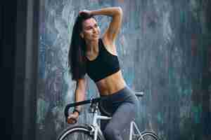 Free photo woman biking in city