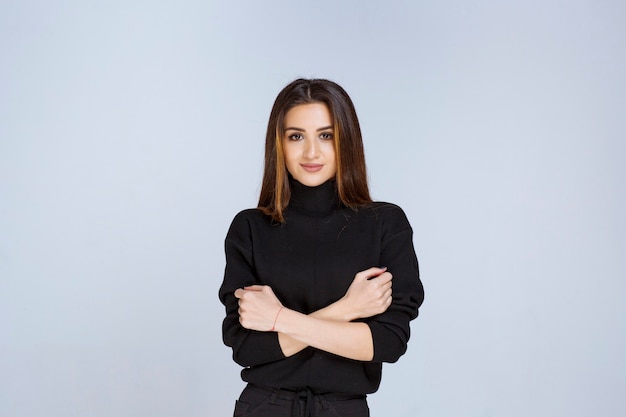 Woman in black shirt giving neutral and flirtatious poses