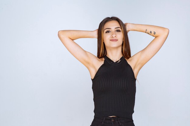 Woman in black shirt giving positive and seductive poses. 