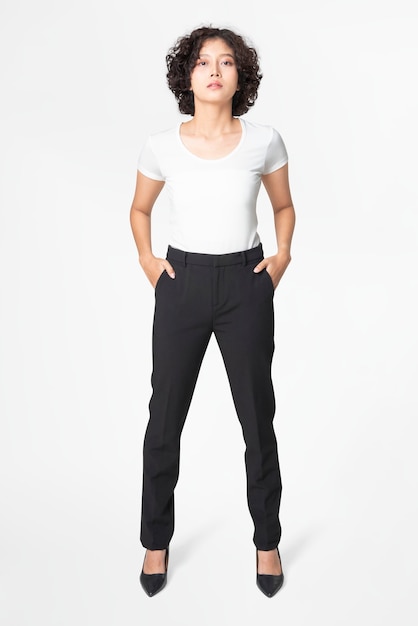 Woman in black slack pants and white tee full body