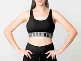 Free photo woman in black sports bra and leggings activewear apparel full body