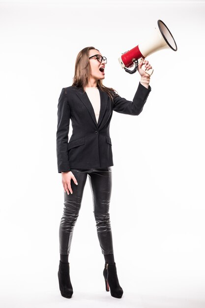 Woman in black suite screaming on a megaphone isolated over white
