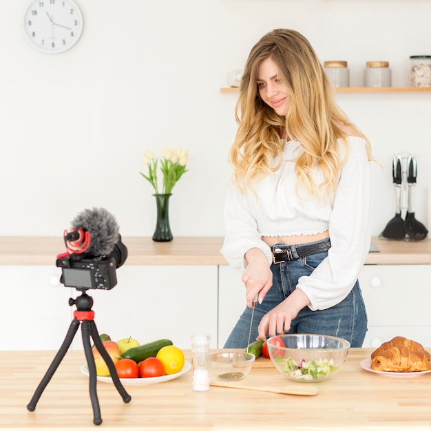 Free photo woman blogger cooking at home