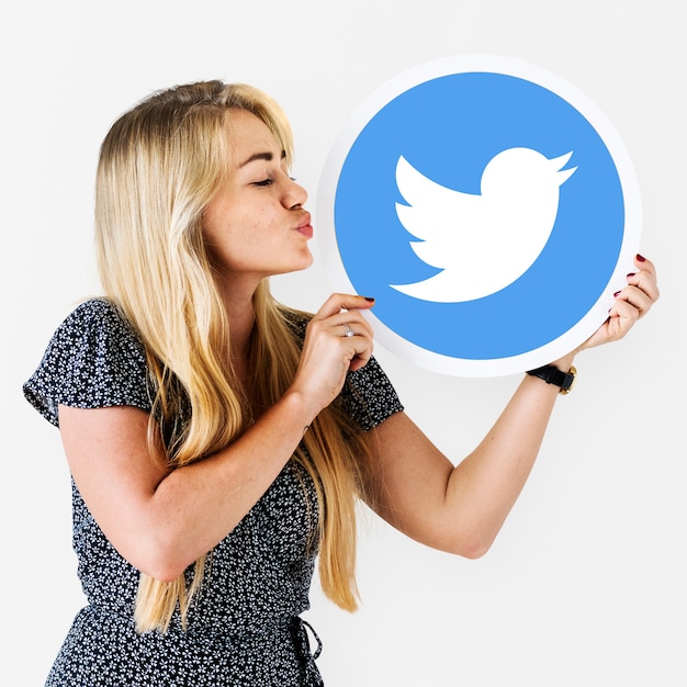 Free photo woman blowing a kiss to a twitter icon