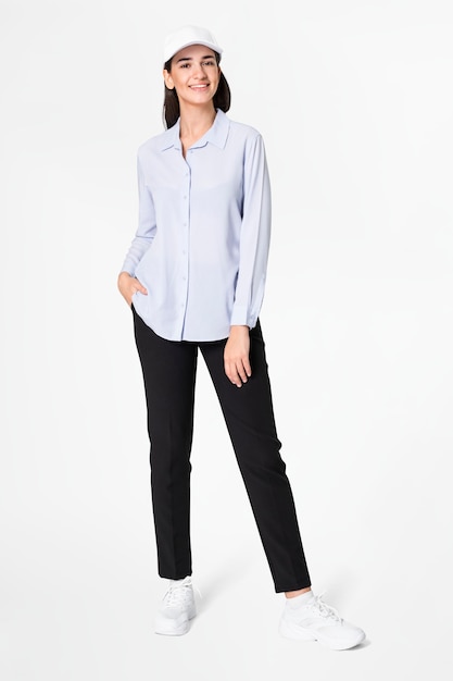 Woman in blue shirt and pants with hat casual wear fashion full body