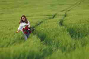 Free photo woman in blue shirt  in a summer field