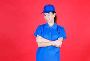 Free photo woman in blue uniform giving positive and neutral poses.