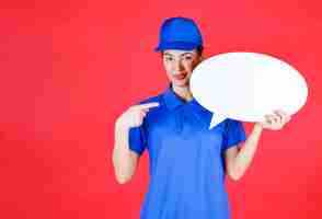 Free photo woman in blue uniform holding an ovale idea board .