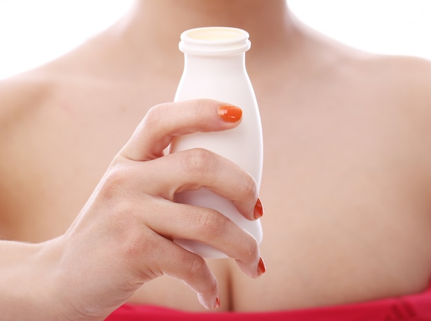 Woman and bottle of yogurt