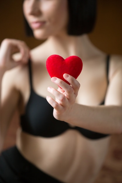 Woman in bra with a heart