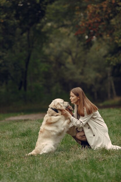 Woman in a brown coat. Lady with a labrador