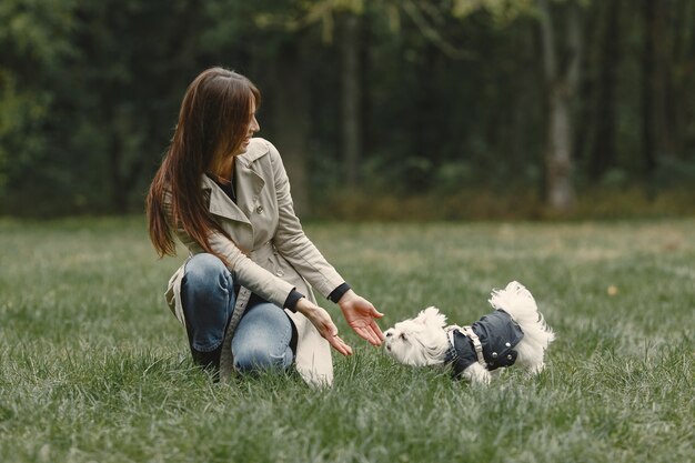 Woman in a brown coat. Lady with a labrador