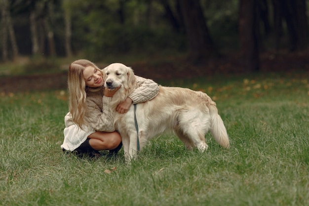 Woman in a brown sweater. Lady with a labrador