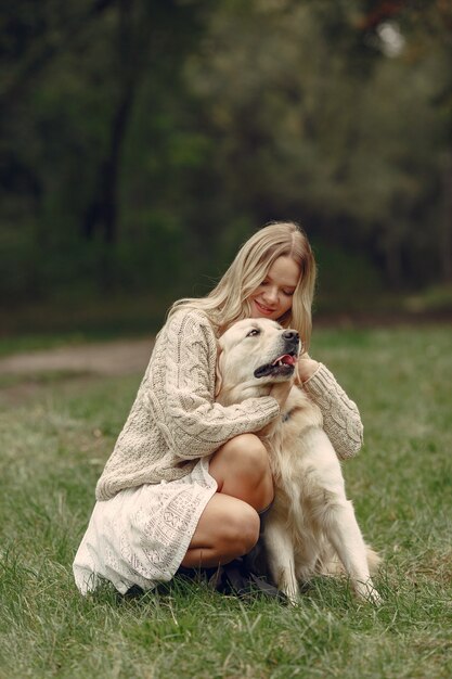 Woman in a brown sweater. Lady with a labrador