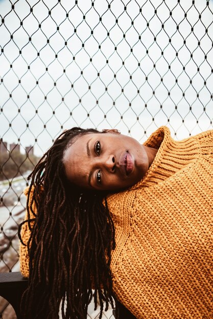 Free photo woman in brown sweater posing