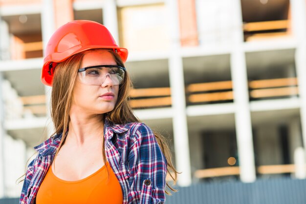 Woman in builder helmet