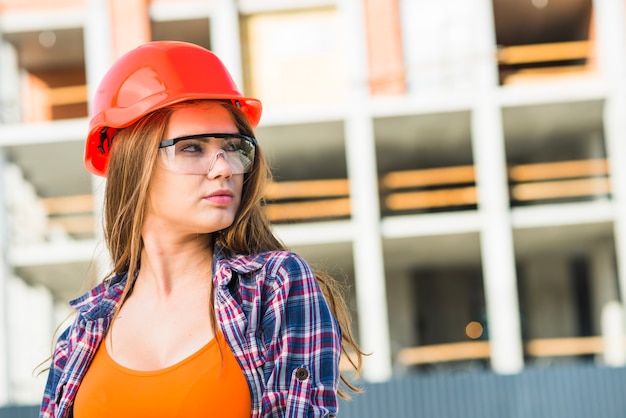 Woman in builder helmet