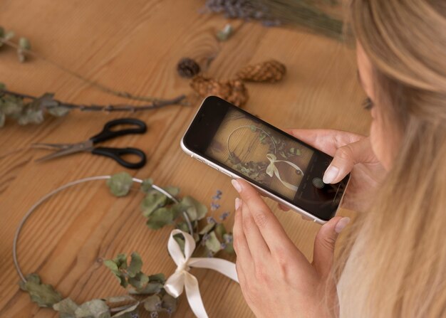 Woman building her own dried flowers arrangement