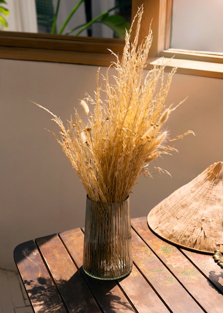 Woman building her own dried flowers arrangement