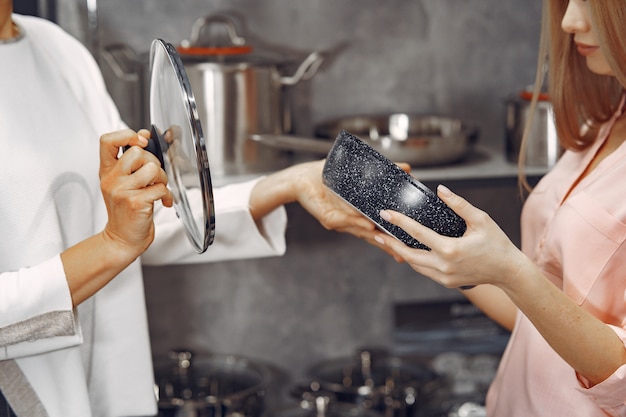 Woman buys dishes in the store