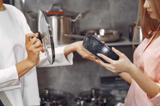 Woman buys dishes in the store