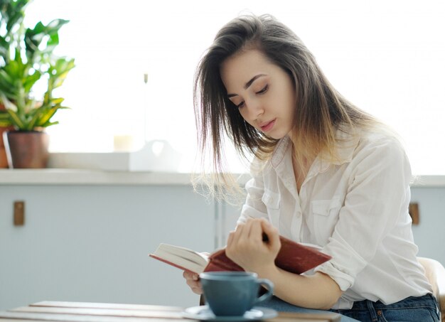 Woman in cafe reading