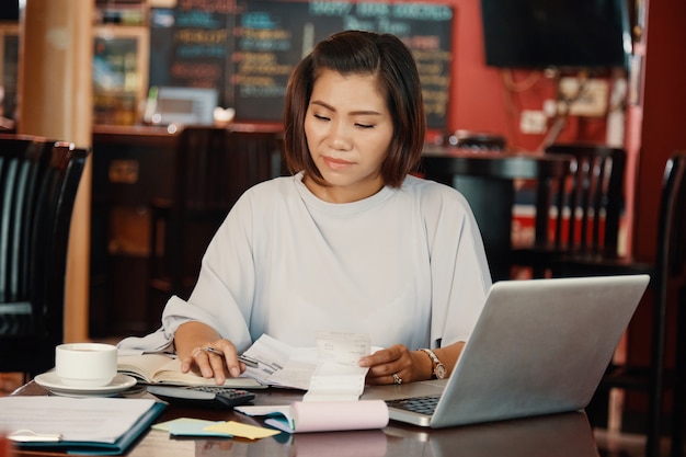 woman calculating expenses