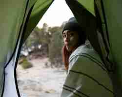 Free photo woman camping in the woods