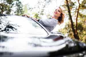 Free photo woman in car looking away