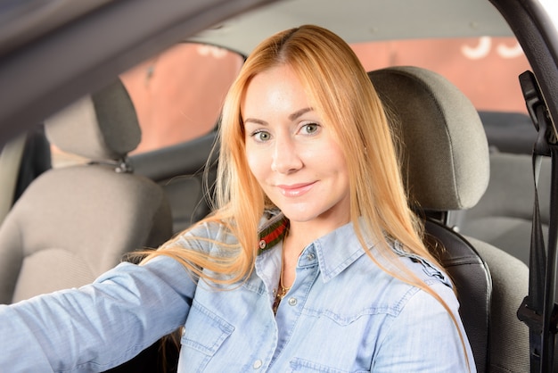 Woman in car with massage seat cushion