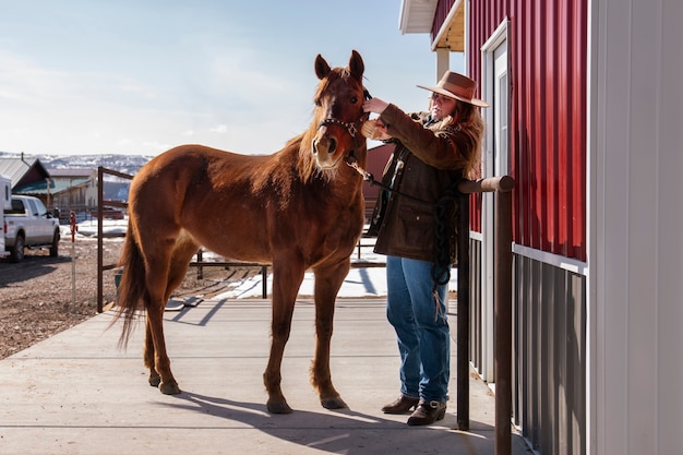 Woman caring about her horse