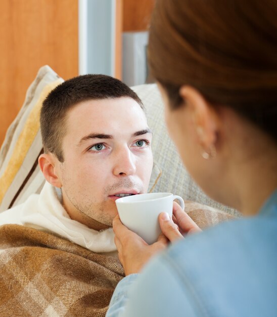 woman caring for unwell man