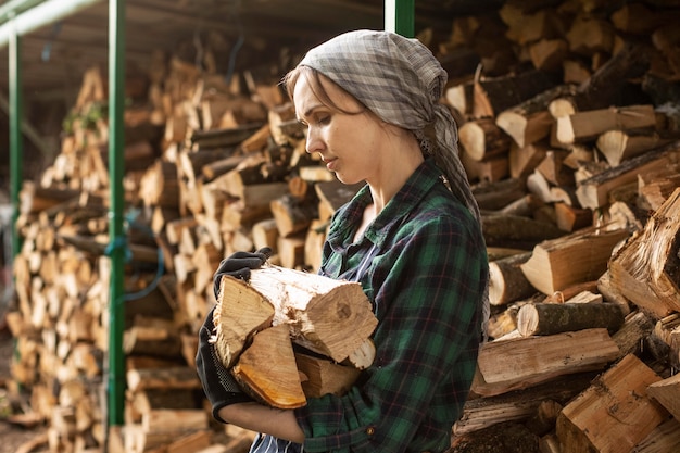 Free photo woman carring fire wood