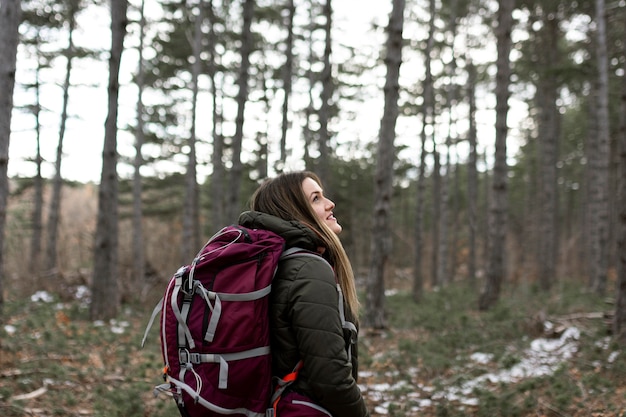 Woman carrying backpack medium shot