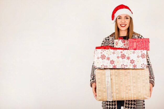 Woman carrying different gift boxes