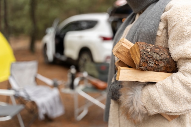 Woman carrying firewood for bonfire