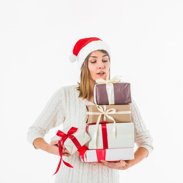 Woman carrying gift boxes in hands 