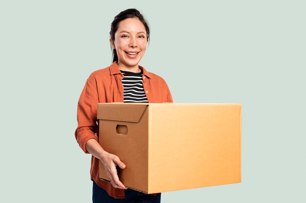 Woman carrying a moving box