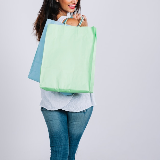 Free photo woman carrying shopping bags