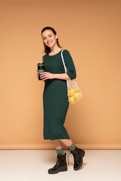 Woman in casual clothes carrying reusable turtle bag