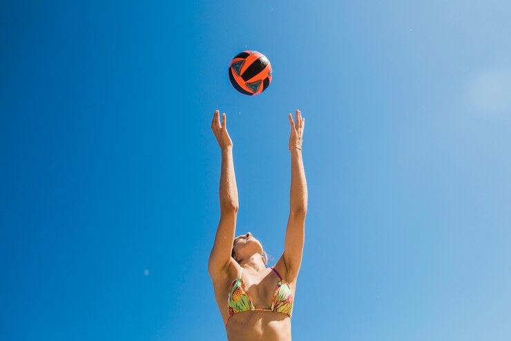 Free Photo woman catching volleyball