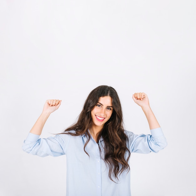 Woman celebrating with arms raised