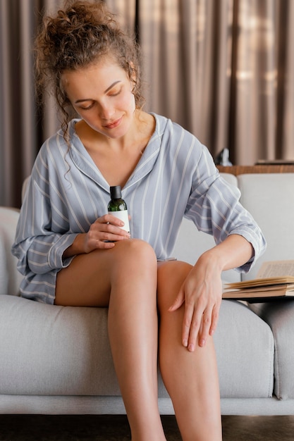 Woman on chair applying lotion