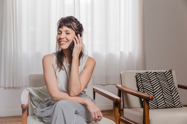 Free photo woman in chair at home