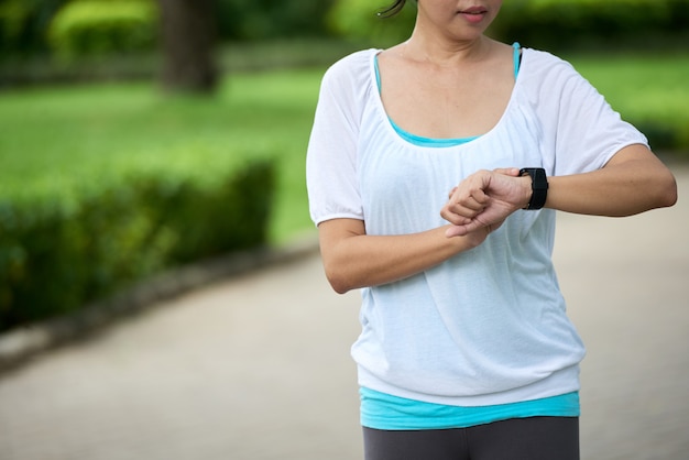 Woman Checking Fitness Bracelet