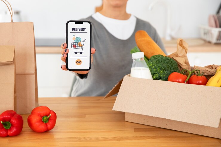 Free Photo woman checking her delivery of groceries
