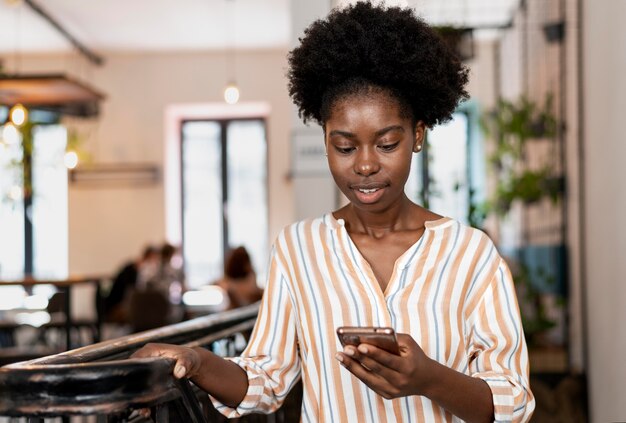 Woman checking her smartphone for notifications