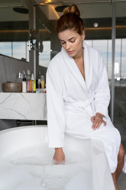 Woman checking the water for her bath