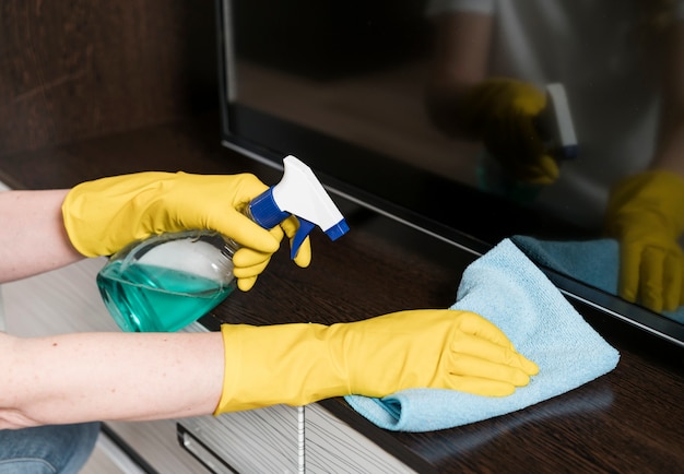 Woman cleaning furniture