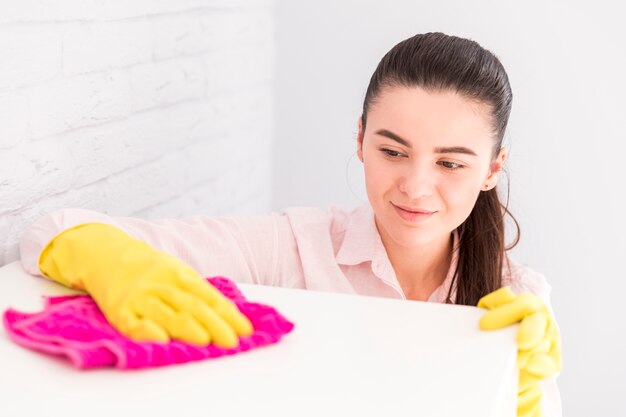 Woman cleaning her home